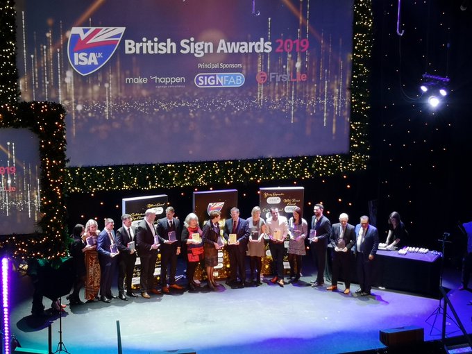 View of the British Sign Awards 2019 winners receiving their trophies