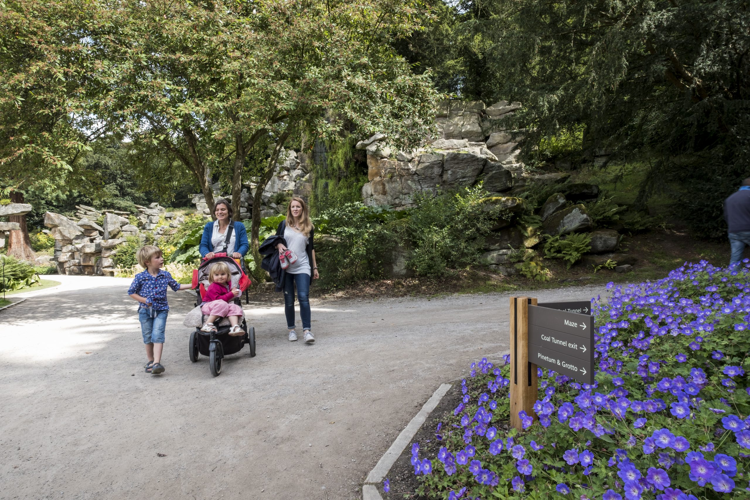 Outdoor view of family at Chatsworth enjoying the gardens (image features ABG Design signage in the foreground.