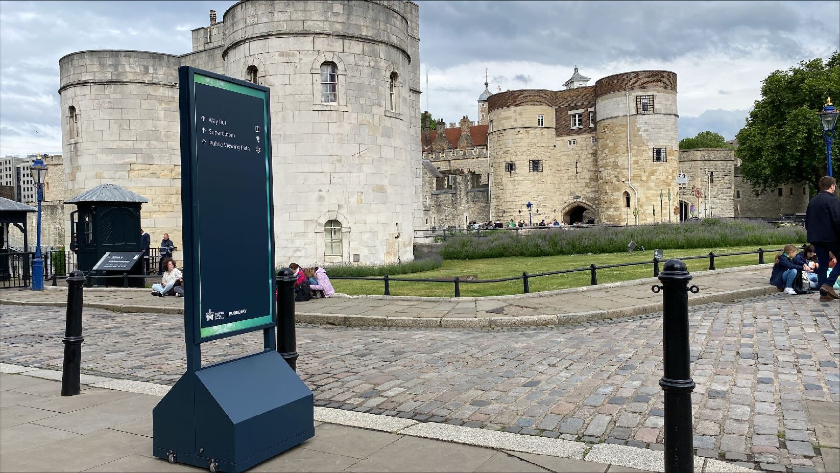 Outdoor signage totem for 'Superbloom', Tower of London by isGroup (totem in the foreground against Tower of London background view