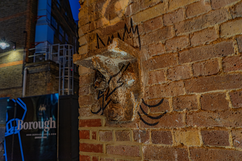 Example of industrial ironmongery attached to wall turned into a gorgoyle feature
