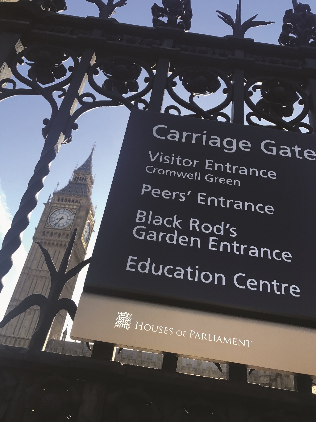 Looking up from low level view of ABG Design signage for Houses of Parliament with Big Ben in the background